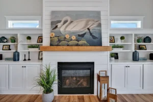 Modern farmhouse living room with white shiplap fireplace, wood mantel, and built-in shelves.